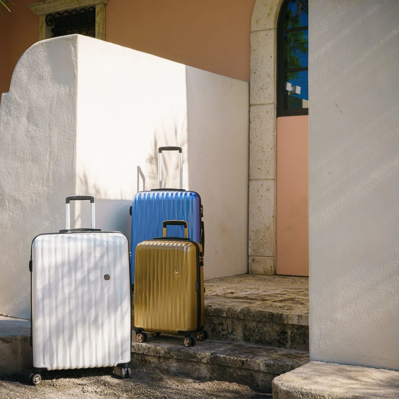 SwissGear luggage set in a sunlit archway