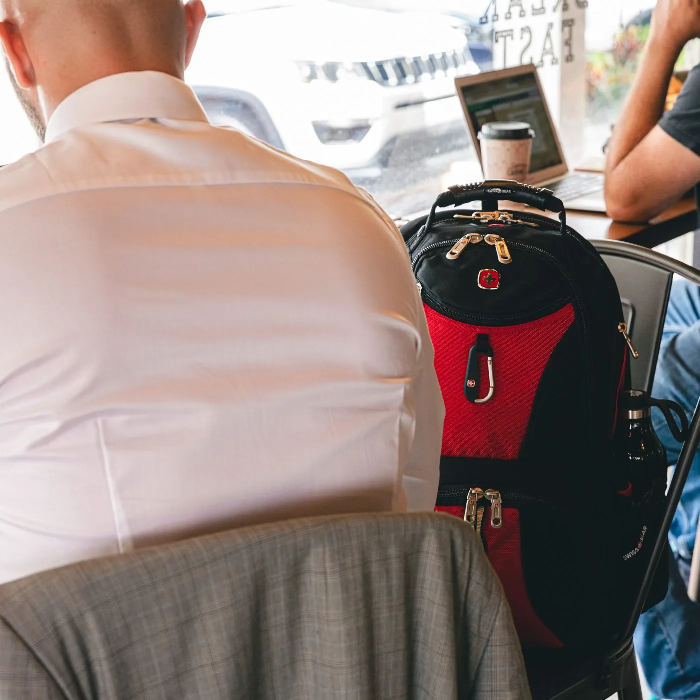 SwissGear backpack in a coffee shop