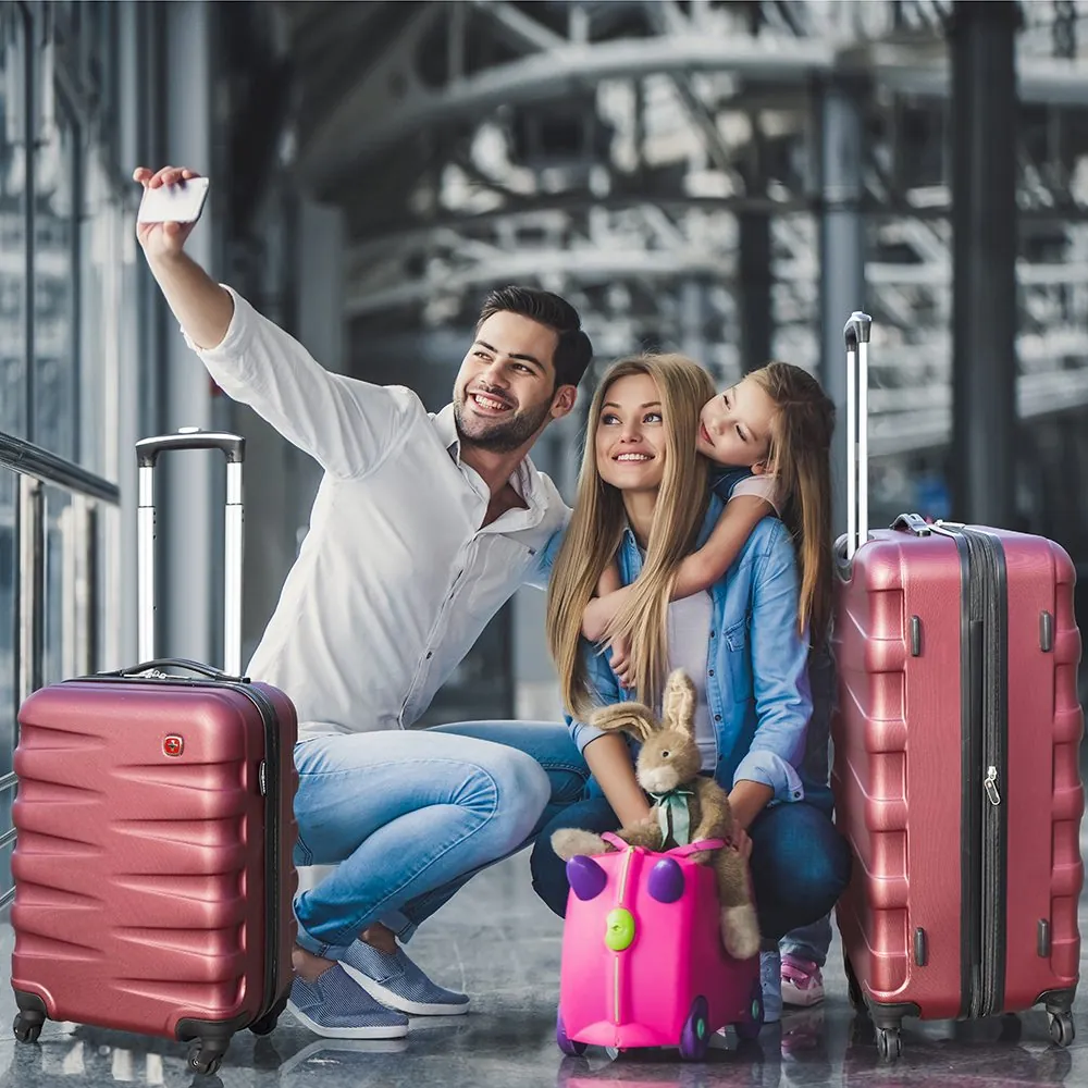 Family taking a selfie with SwissGear luggage